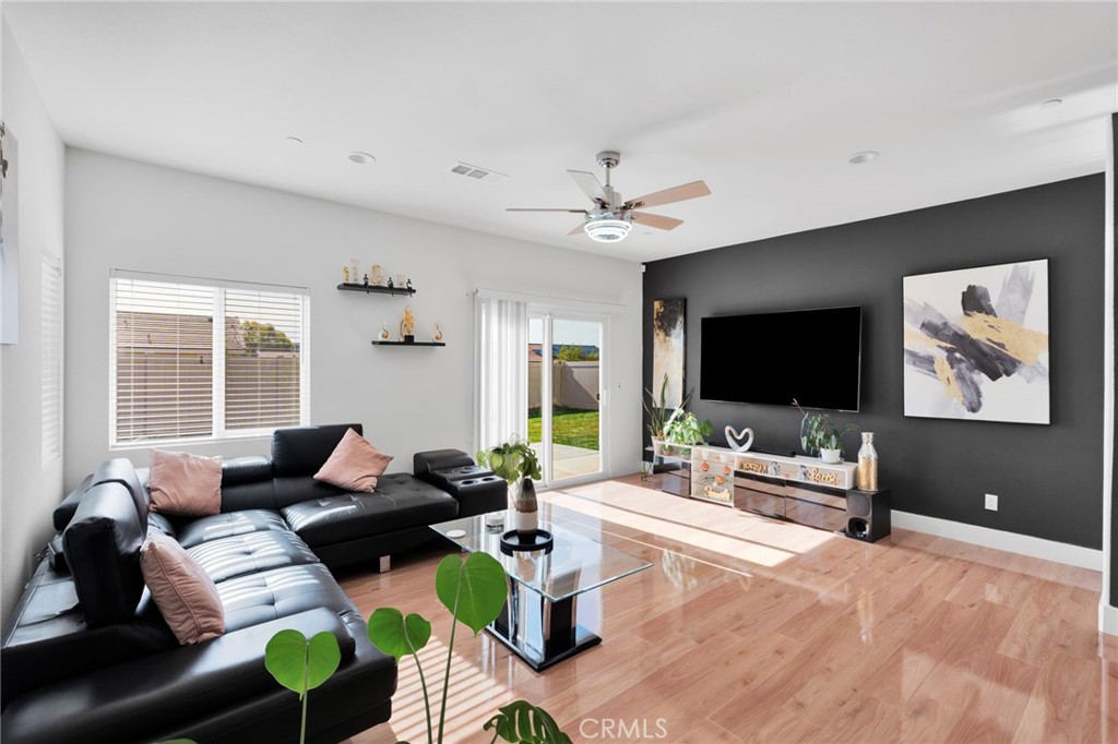 35153 Webb Place Beaumont, CA 92223 - Photo 15 of 42 a living room with furniture and a flat screen tv