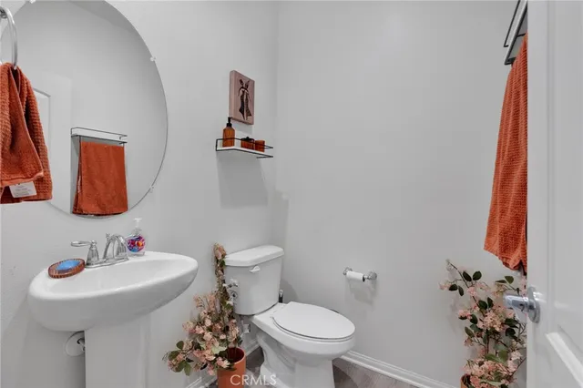 a living room with furniture a rug and a wooden floor