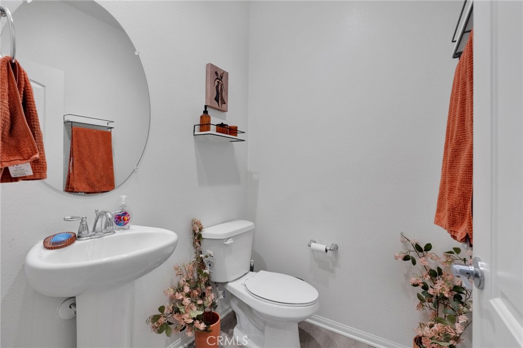 35153 Webb Place Beaumont, CA 92223 - Photo 19 of 42 a bathroom with a sink toilet and a mirror