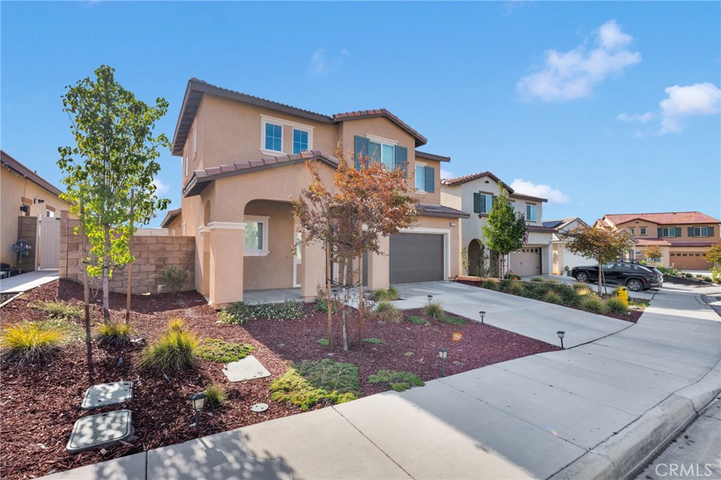 35153 Webb Place Beaumont, CA 92223 - Photo 2 of 42 a front view of a house with a yard