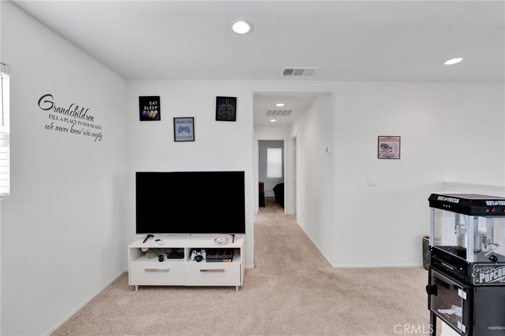 35153 Webb Place Beaumont, CA 92223 - Photo 22 of 42 a living room with furniture and a flat screen tv