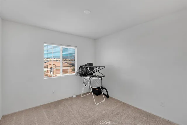 an empty room with closet area