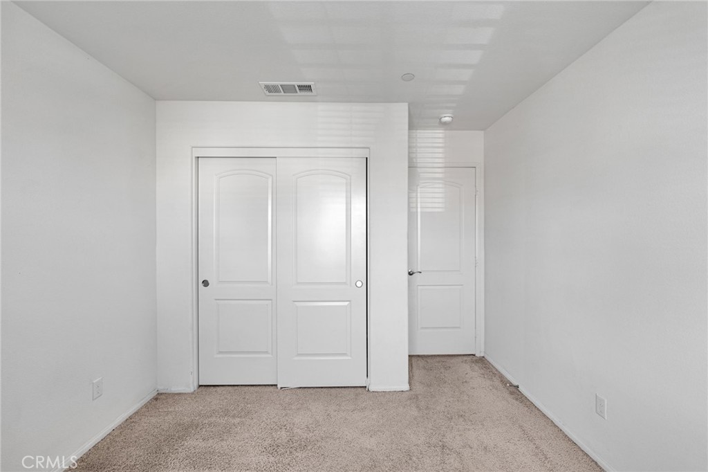 35153 Webb Place Beaumont, CA 92223 - Photo 26 of 42 an empty room with closet area