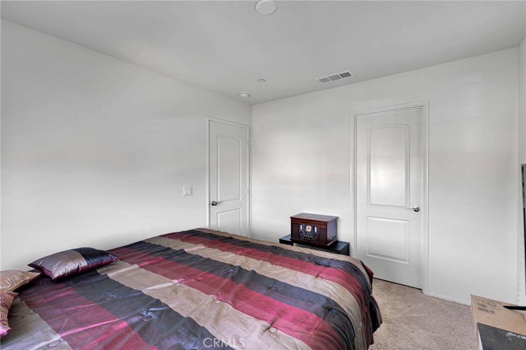 35153 Webb Place Beaumont, CA 92223 - Photo 28 of 42 a bedroom with a bed and a closet