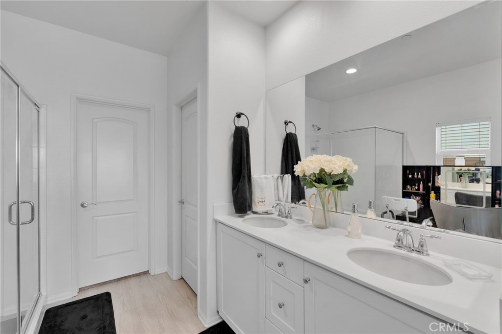 35153 Webb Place Beaumont, CA 92223 - Photo 32 of 42 a bathroom with double vanity sink and a mirror