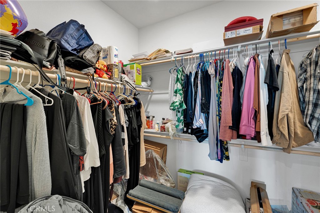 35153 Webb Place Beaumont, CA 92223 - Photo 34 of 42 a view of walk in closet with clothes