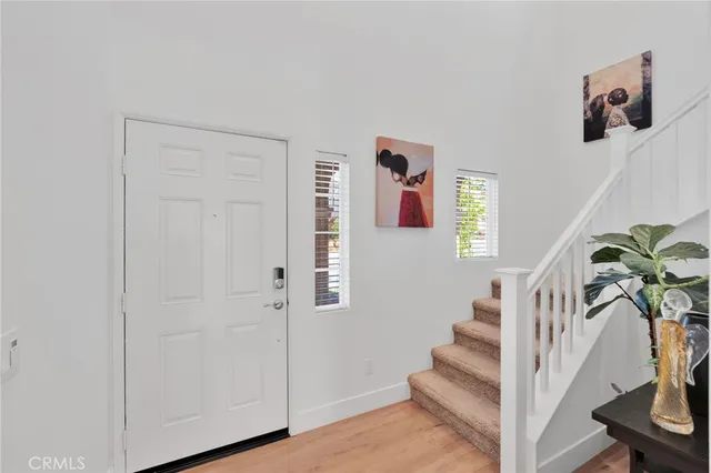 a large kitchen with sink a center island stainless steel appliances and cabinets