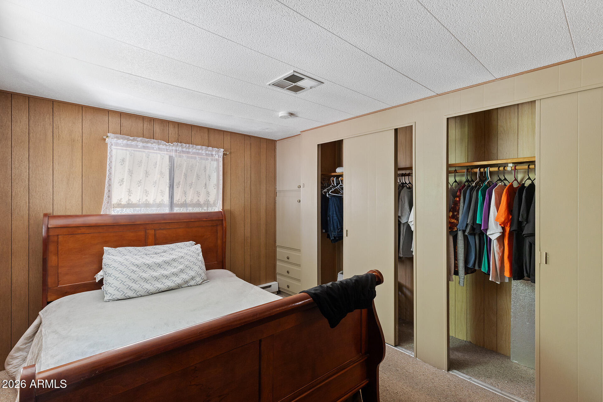 10540 East Apache Trail, Unit 151 Apache Junction, AZ 85120 - Photo 11 of 31 a bedroom with a bed and a window