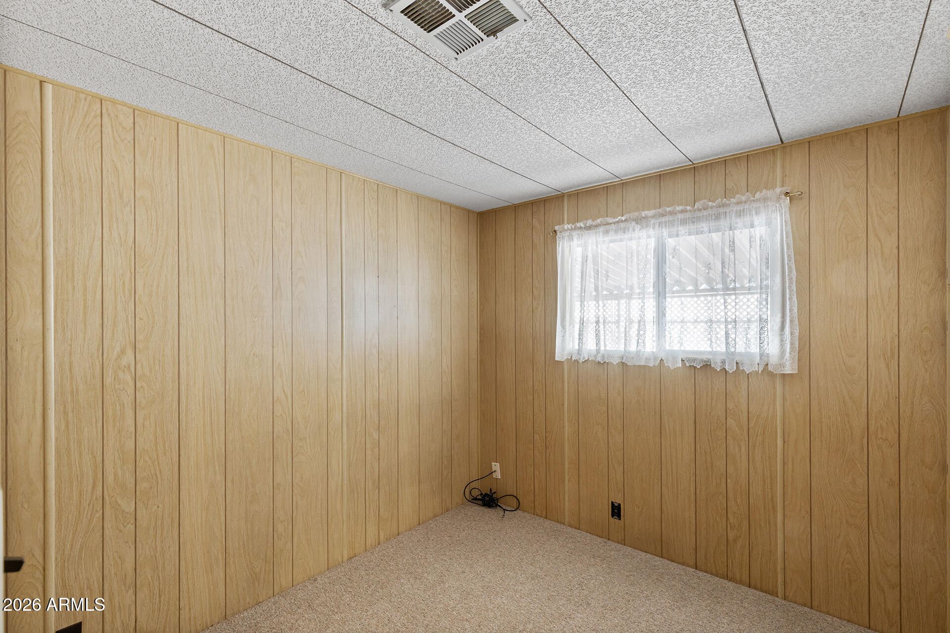 10540 East Apache Trail, Unit 151 Apache Junction, AZ 85120 - Photo 16 of 31 a view of an empty room with a window