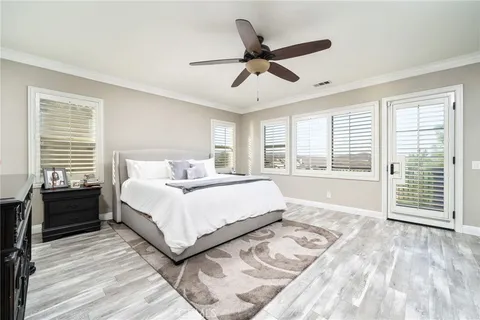a living room with a flat screen tv and a fireplace