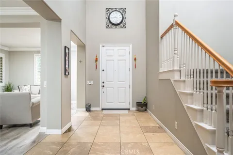 a view of an entryway with wooden floor