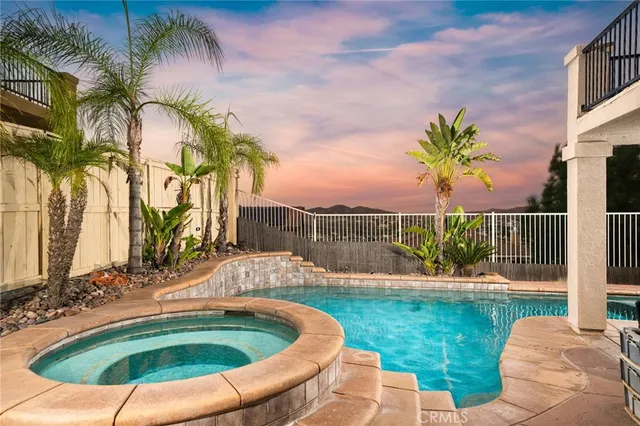 an aerial view of a house with a lake view