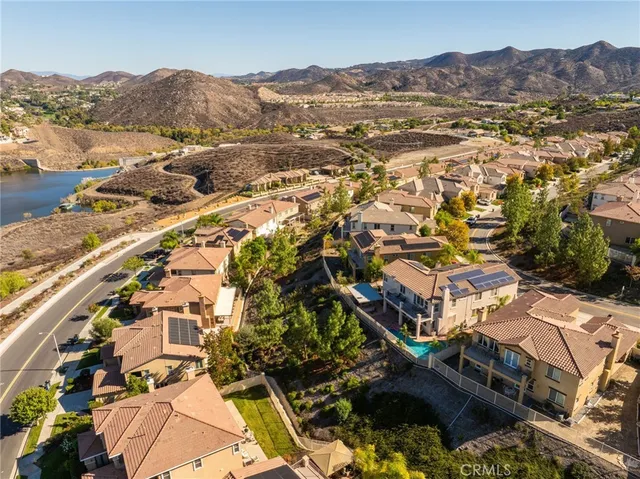 an aerial view of a city with lake view