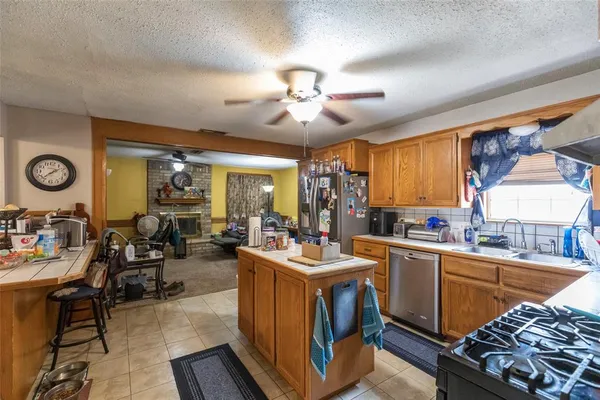 a view of a kitchen and dining room