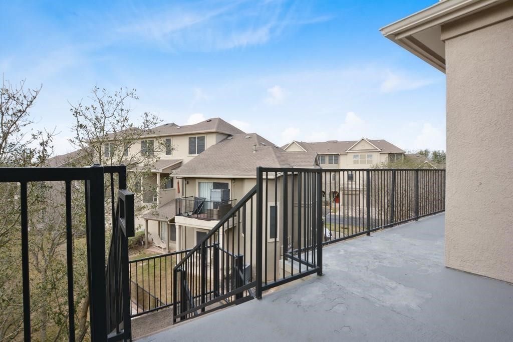 11203 Ranch Road 2222, Unit 1602 Austin, TX 78732 - Photo 11 of 25 a view of a houses from balcony
