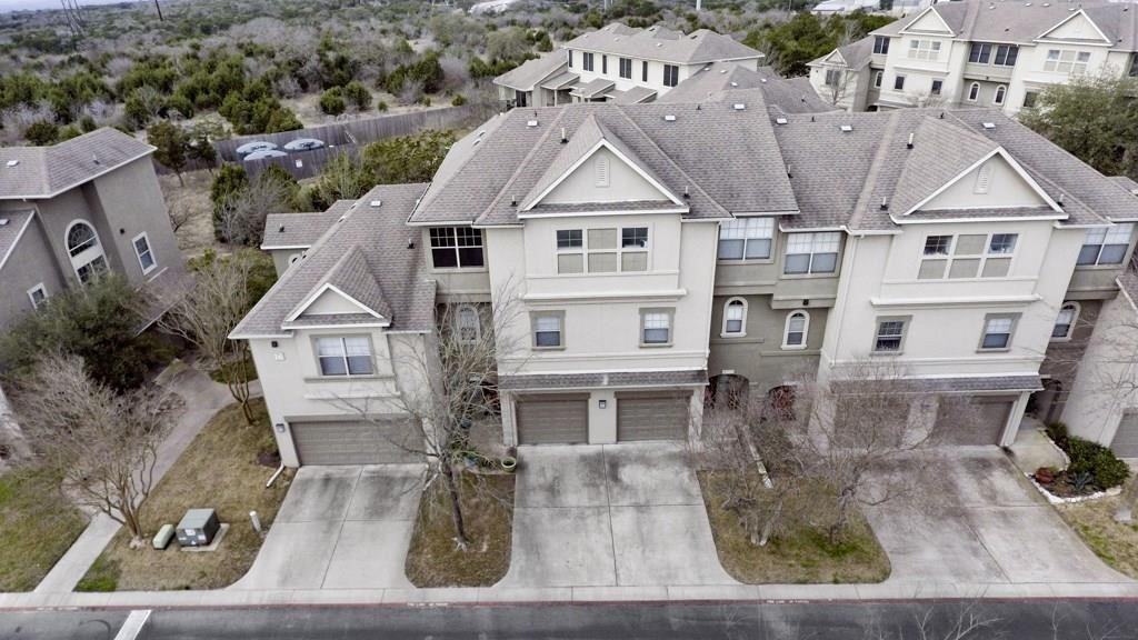11203 Ranch Road 2222, Unit 1602 Austin, TX 78732 - Photo 25 of 25 an aerial view of a house with a yard