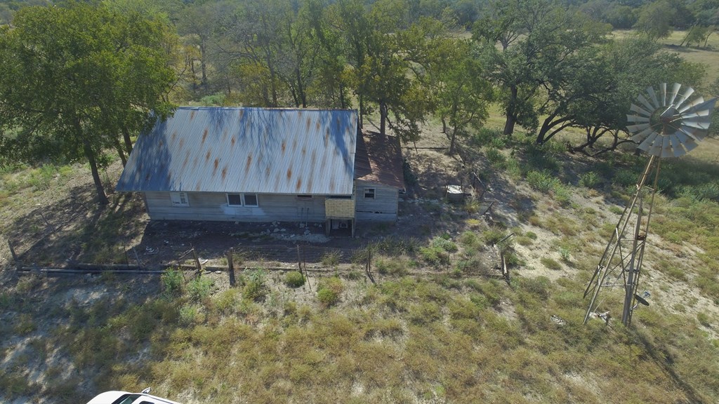 800 Schumann Road Stonewall, TX 78671 - Photo 13 of 27 a view of backyard with wooden fence