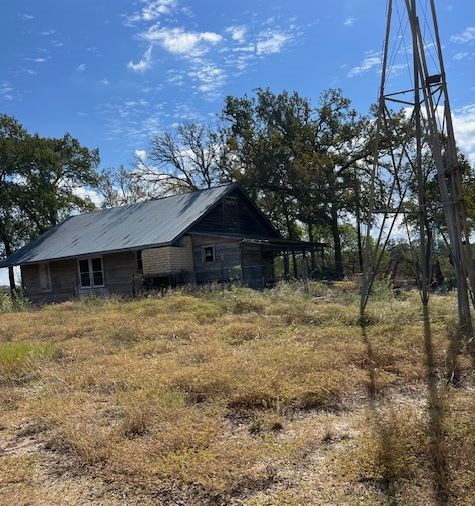 800 Schumann Road Stonewall, TX 78671 - Photo 21 of 27 a backyard of a house