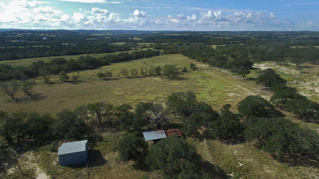 800 Schumann Road Stonewall, TX 78671 - Photo 23 of 27 a view of a lake from a yard