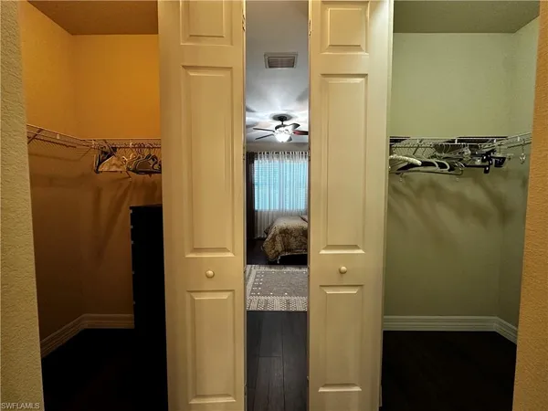 a bathroom with a light fixture a mirror and a shower