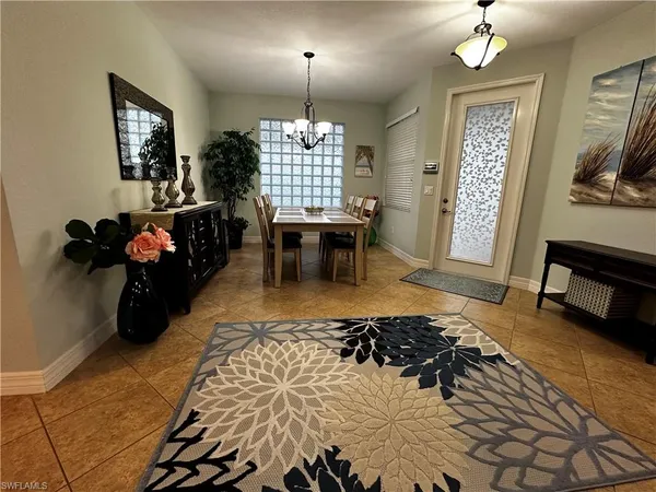 a living room with furniture rug and window