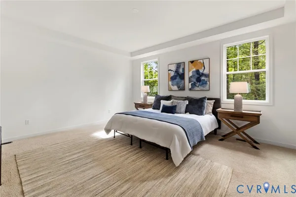 a spacious bedroom with a bed and a table