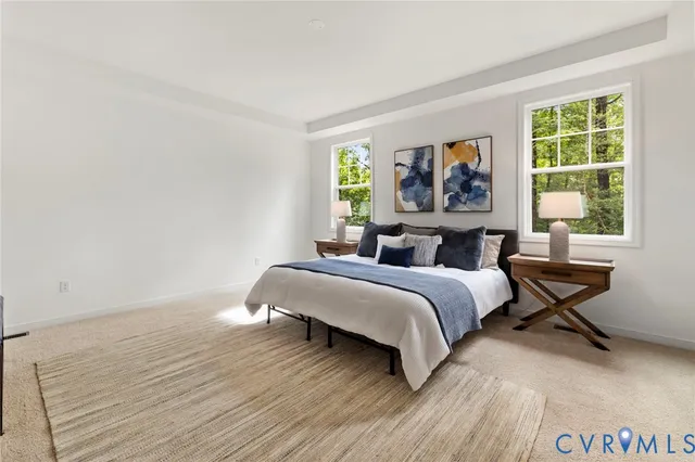 a spacious bedroom with a bed and a table