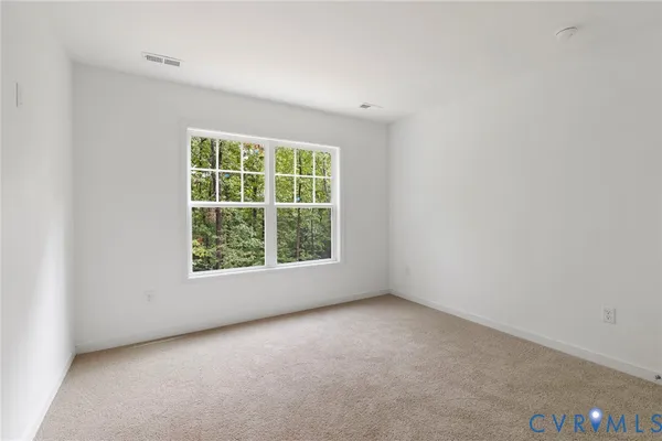 a balcony with wooden floor and outdoor seating