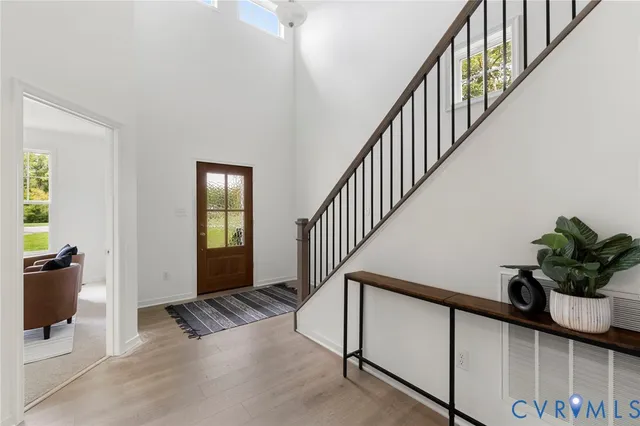 a view of entryway with wooden floor and a potted plant