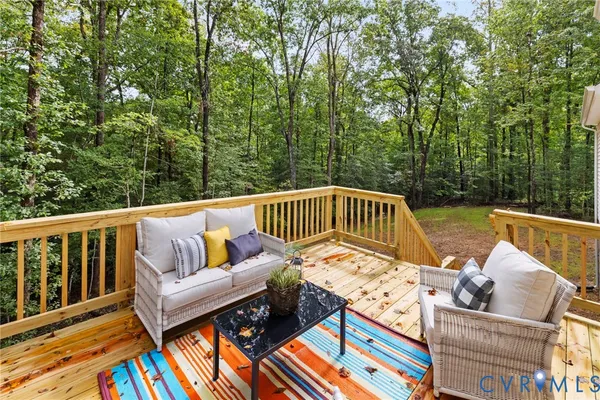 a front view of a house with a garden and yard