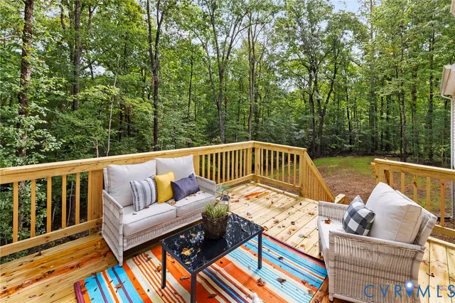 a front view of a house with a garden and yard