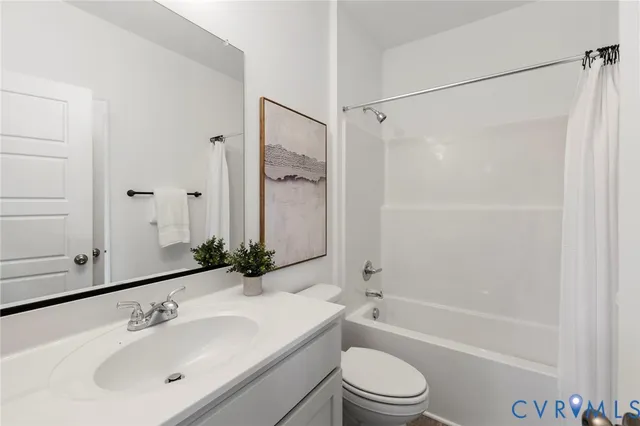 a bathroom with a sink a mirror toilet and bathtub