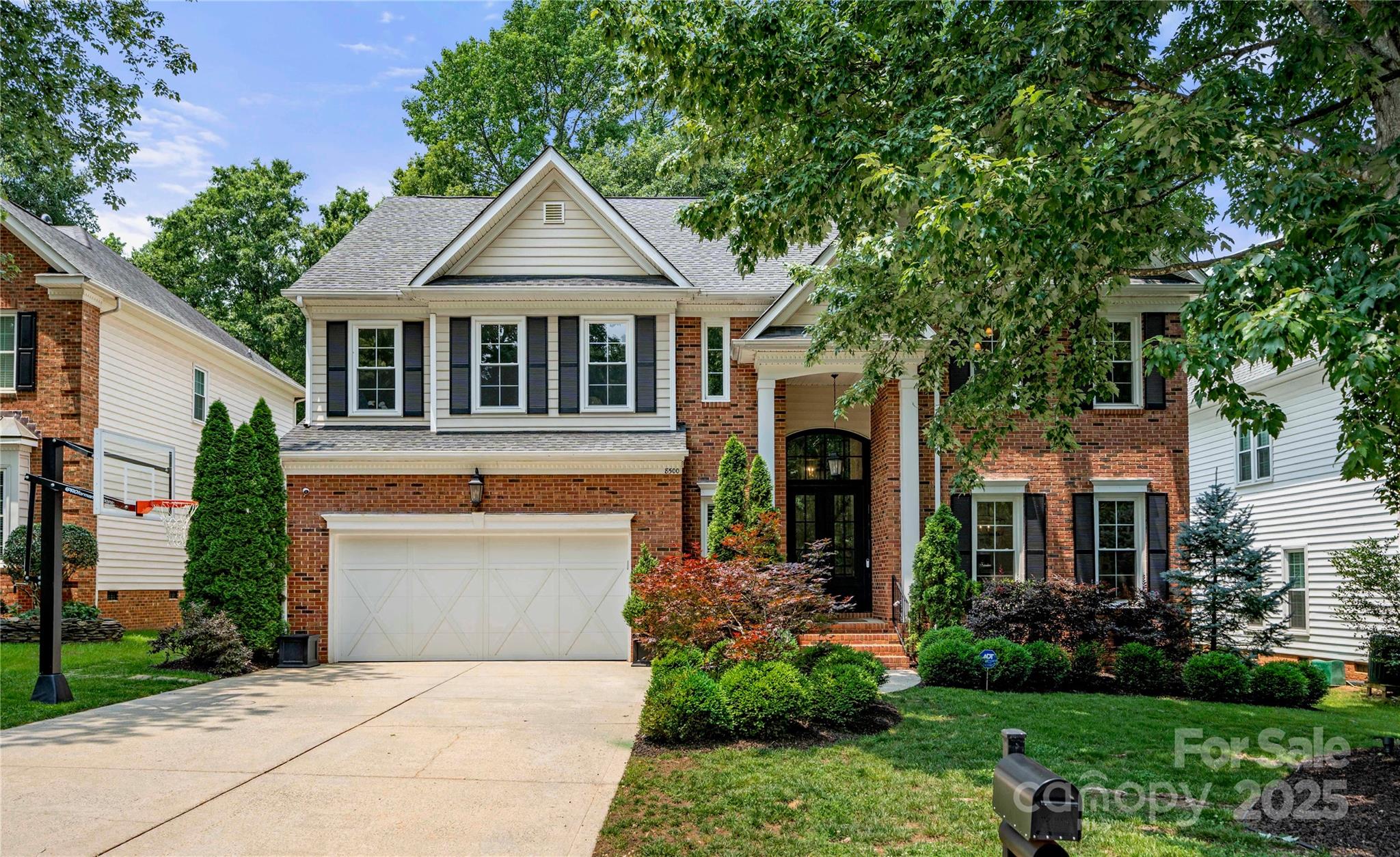 8500 Headford Road Charlotte, NC 28277 - Photo 1 of 47 a front view of a house with a garden