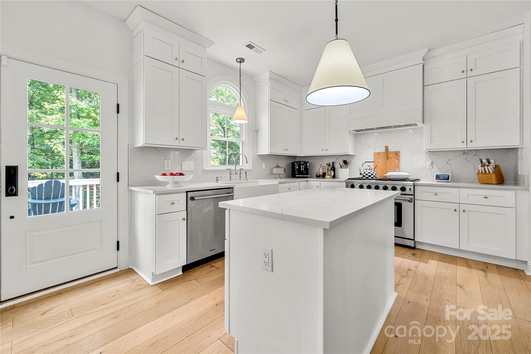 8500 Headford Road Charlotte, NC 28277 - Photo 19 of 47 a kitchen with a sink window and cabinets