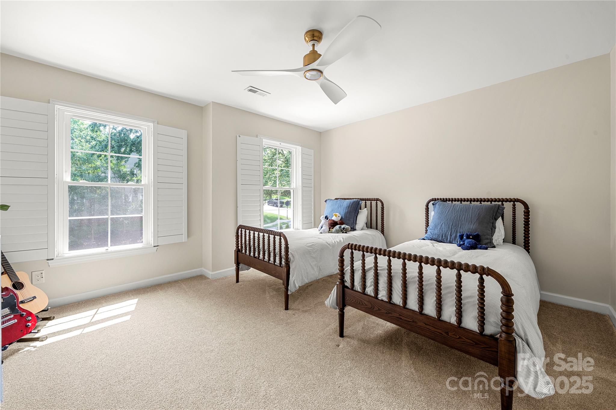 8500 Headford Road Charlotte, NC 28277 - Photo 34 of 47 a bedroom with three beds and a window