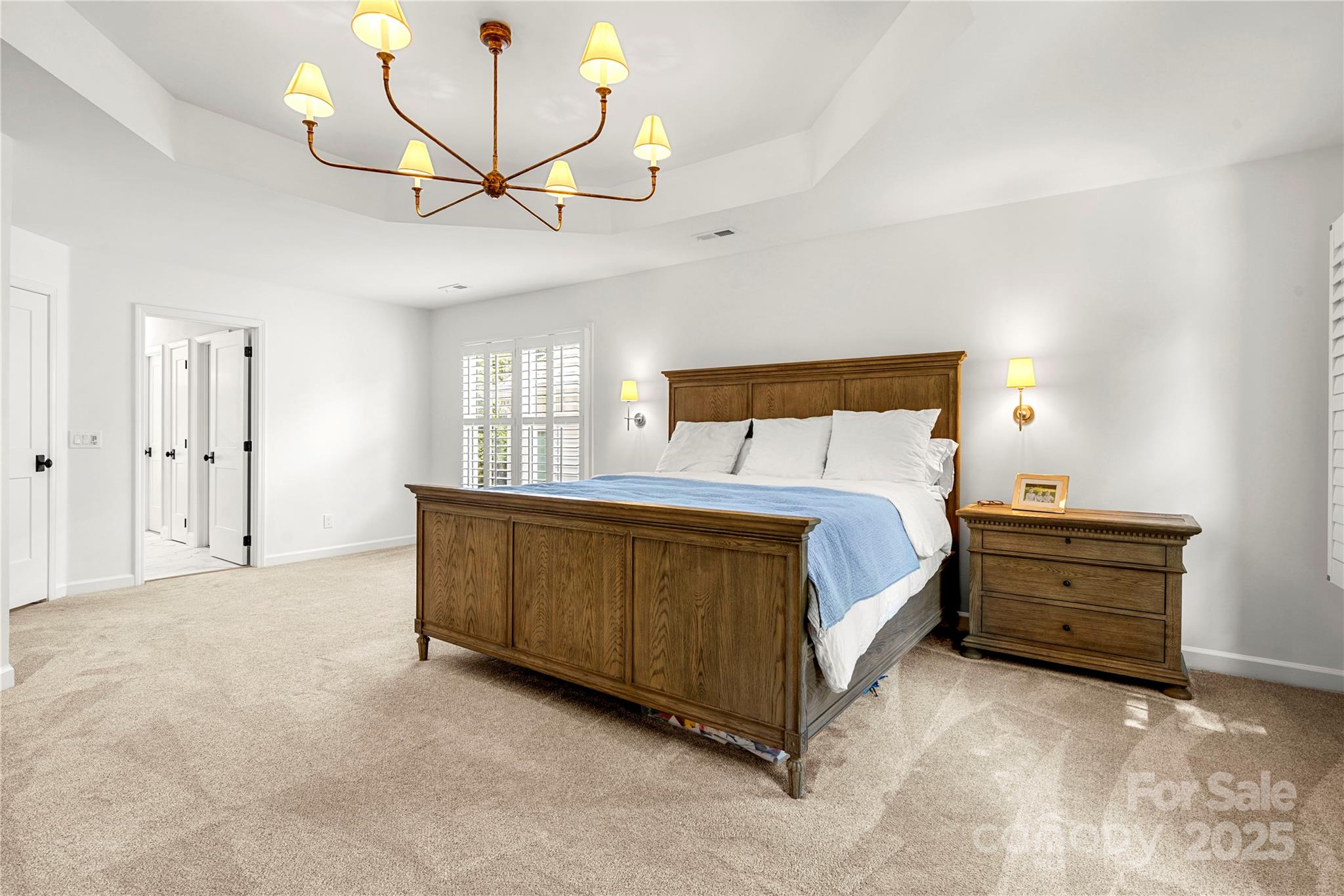 8500 Headford Road Charlotte, NC 28277 - Photo 36 of 47 a spacious bedroom with a bed chandelier and a window
