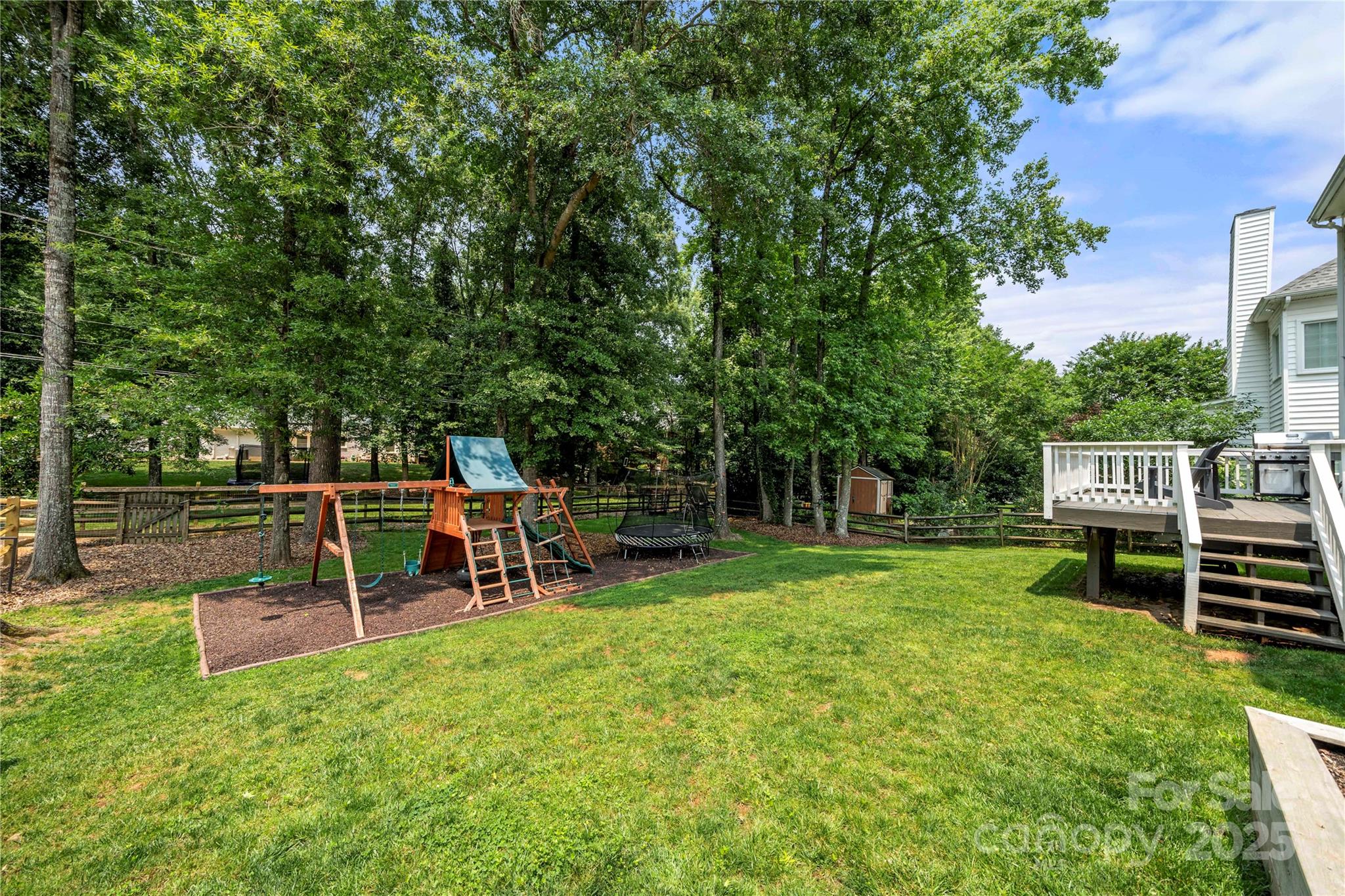 8500 Headford Road Charlotte, NC 28277 - Photo 44 of 47 a view of a park with wooden fence and a bench