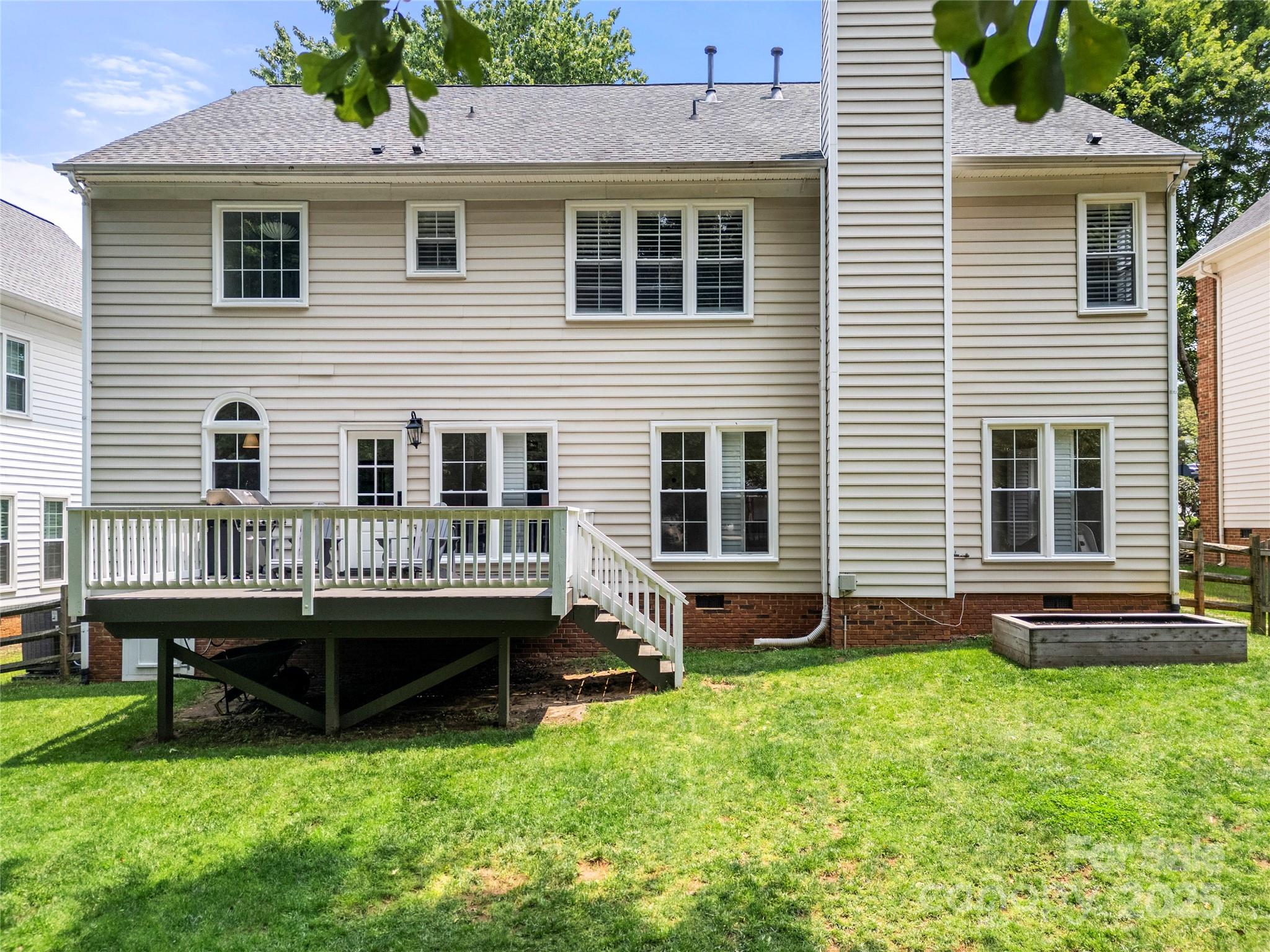 8500 Headford Road Charlotte, NC 28277 - Photo 45 of 47 a view of a house with a backyard and wooden deck