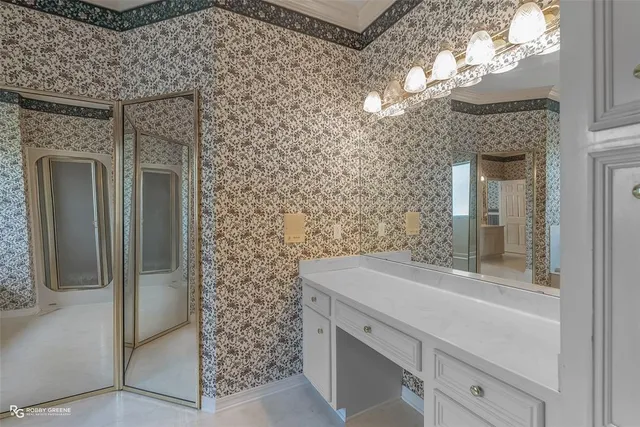 view of a bathroom with a sink and a mirror
