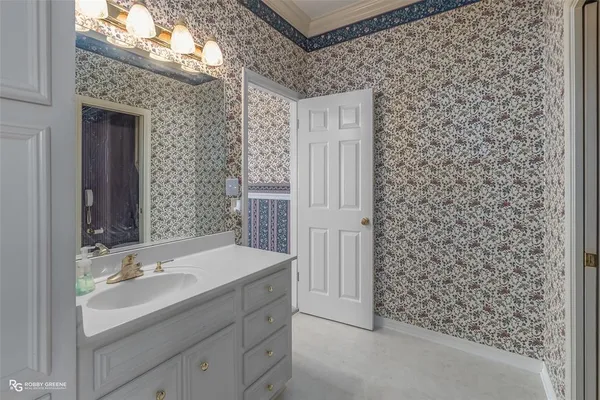 a bathroom with a sink and a mirror
