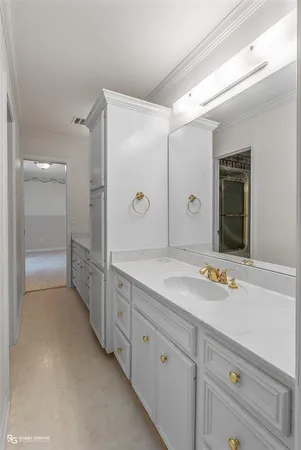 a spacious bathroom with a granite countertop sink mirror and double