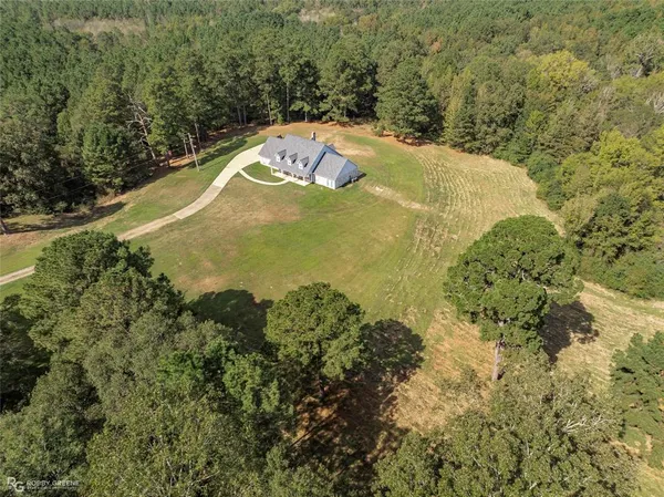 a view of a lake with a yard