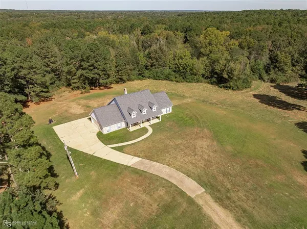 a view of a swimming pool with a yard