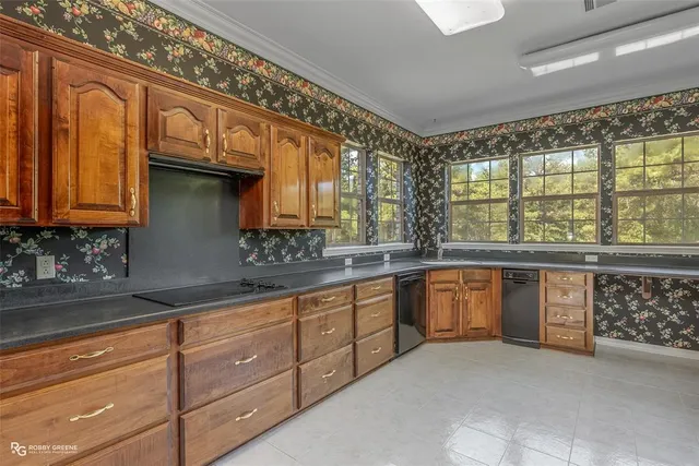 a spacious bathroom with a granite countertop sink and a large mirror