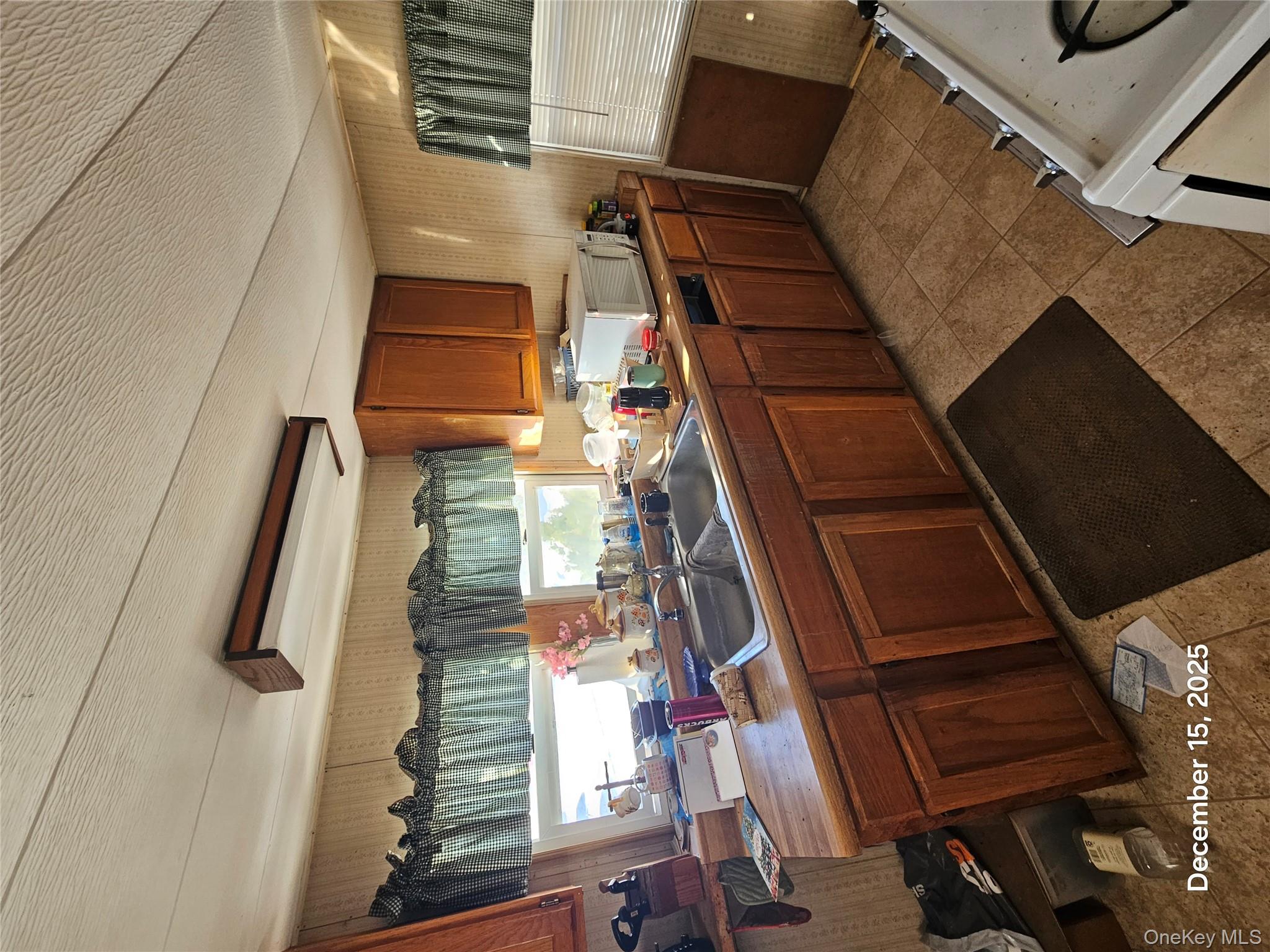 3485 Highway 9 Cold Spring, NY 10516 - Photo 5 of 10 a kitchen with a sink a stove a refrigerator and cabinets