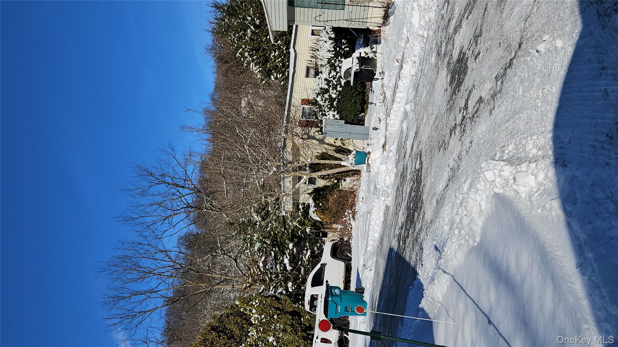 3485 Highway 9 Cold Spring, NY 10516 - Photo 9 of 10 a view of a parking space with lots of trees in the background