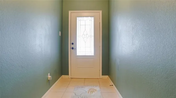 a bathroom with a window and a shower