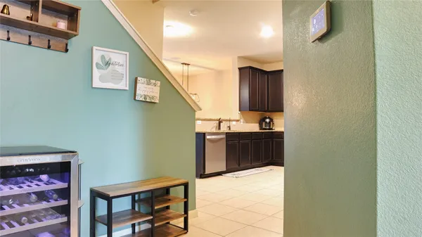 a view of a patio with table and chairs and potted plants