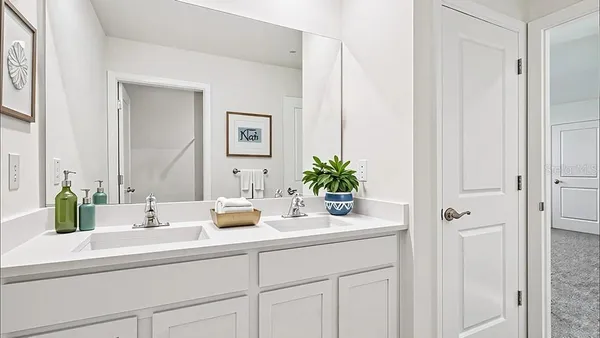 a bathroom with cabinets and sink