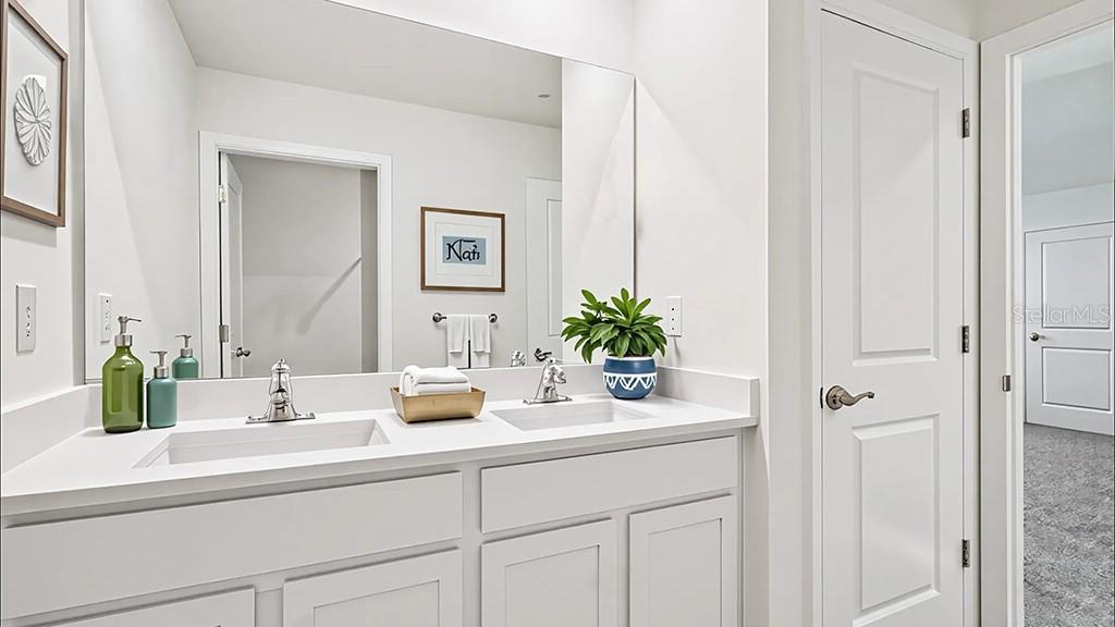 5221 Southwest 40th Circle Ocala, FL 34474 - Photo 13 of 32 a bathroom with cabinets and sink